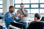 22_01_17 Three people in an informal meeting in an office _GettyImages-628505836