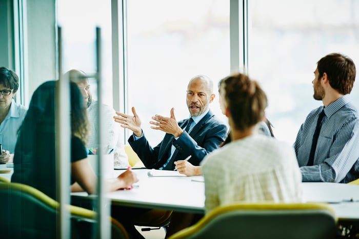 People in conference room.