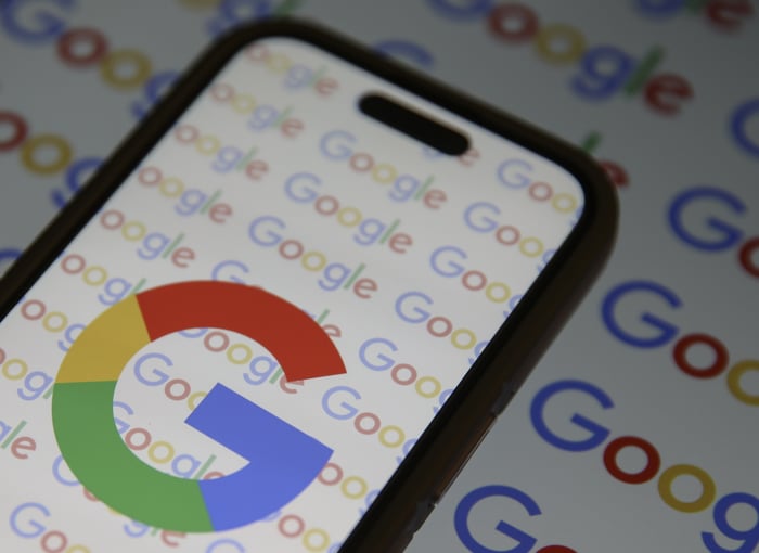 A smartphone with the Google logo displayed on the screen.