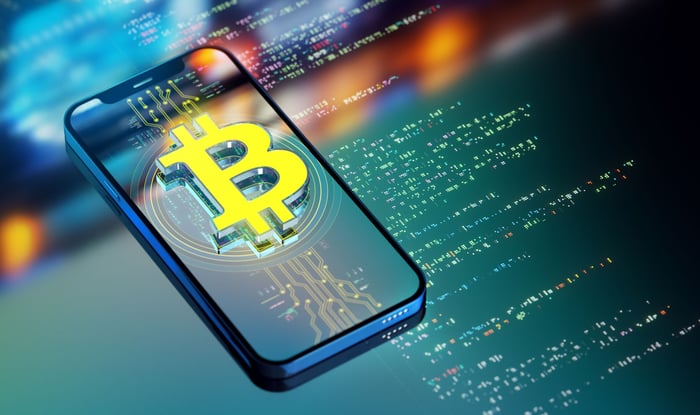 An image of Bitcoin on a phone.
