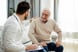Patient talking with a physician.