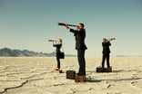 24_07_05 Three people standing on boxes in a desert looking through telescopes _MF Dload GettyImages-149282224-1200x797-bfe2eb8