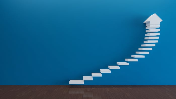 Abstract design of steps in the shape of an upward-sloping arrow.