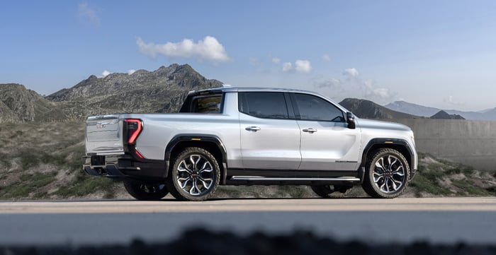 2025 GMC Sierra EV on a mountain road.