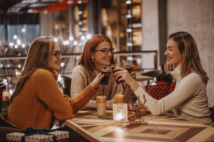 three people drinking cola