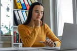 Young woman looking at laptop