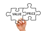 22_04_25 A hand drawing puzzle pieces with the words price and value on them _GettyImages-477457721