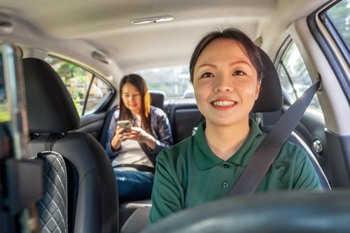A driver and one passenger in a car.