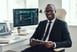 Businessman with a stock chart in the background.