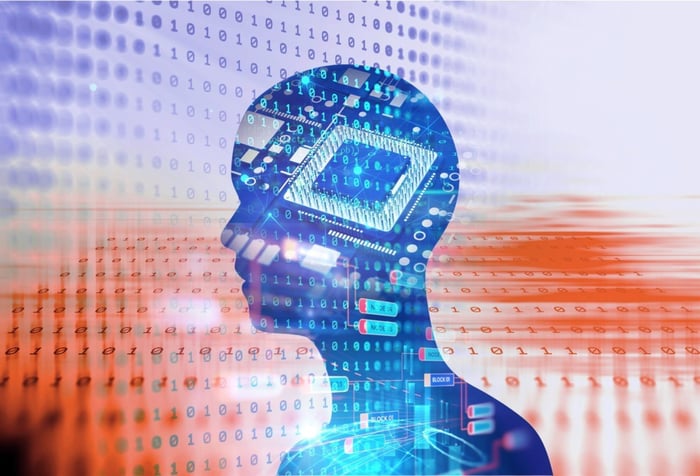 A human profile superimposed on a digital background -- concept for AI.