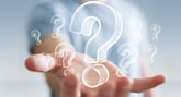 Hand with images of question marks