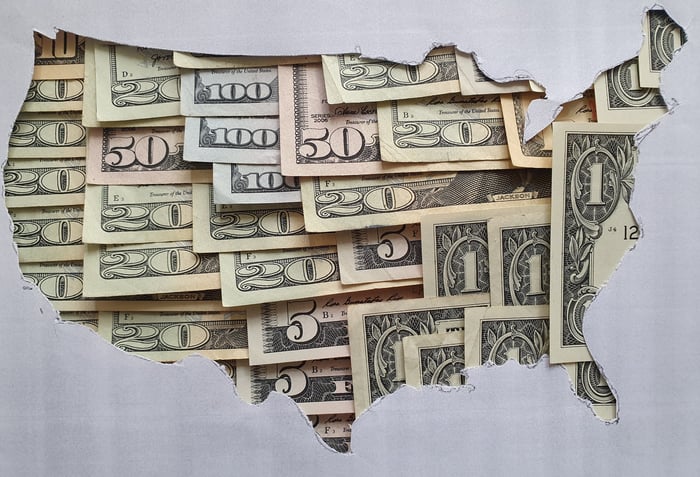 A map of the United States made up of money.