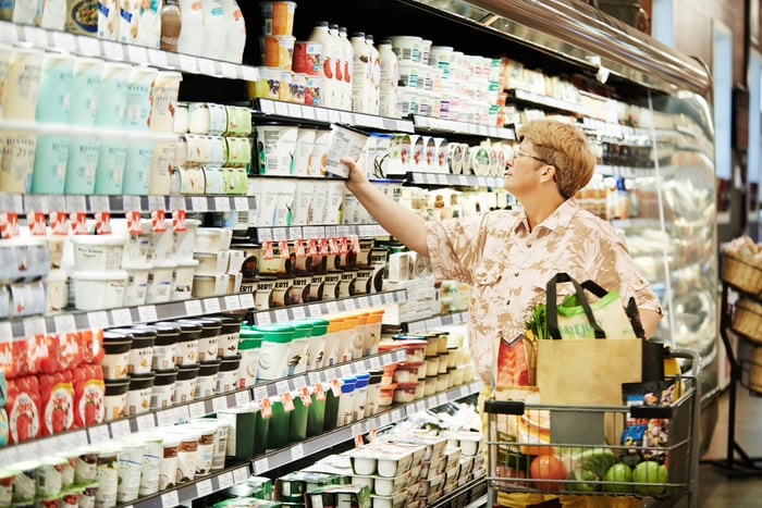 Someone picking out an item in a store.