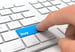 Person-pressing-buy-button-keyboard
