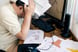 frustrated investor holds head in his hands.