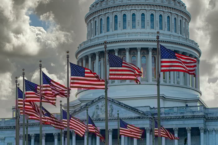 The U.S. Capitol building surrounded by American flags.