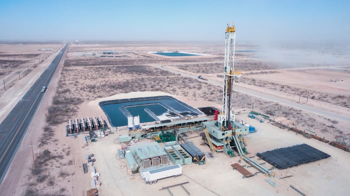 Oil and gas drilling and completion equipment in a desert setting.