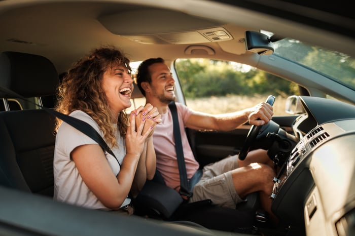 Two people riding in a car. 