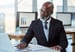 Getty - person in suit at desk laptop thoughtful thinking