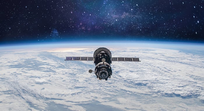 Satellite floating above Earth. 
