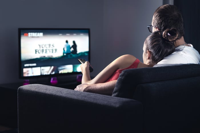 A couple watching TV.
