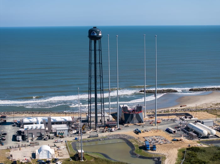 A 28-story water tower looms over Rocket Lab's three-story tall LC-3 launch pad on Wallops Island.