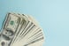dollar bills on blue background stock market investment