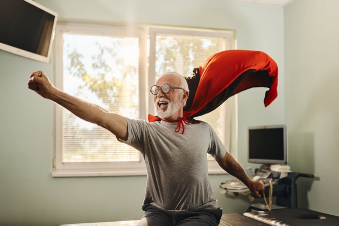 Person with a flowing red superhero cape.