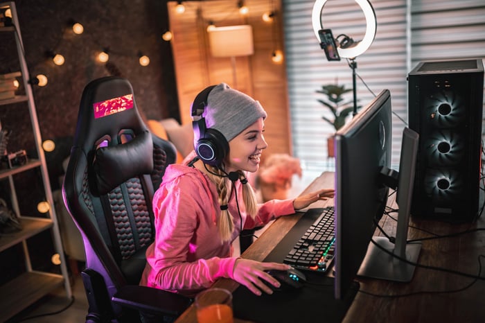 Gamer playing game on desktop.