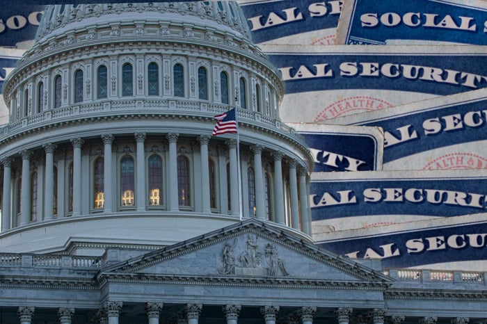 Stack of Social Security cards with a domed building in the forefront. 