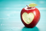 Apple with a heart shape carved in the skin