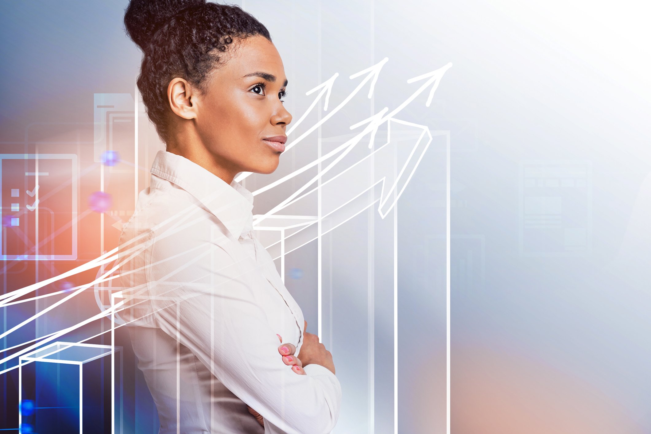 A person standing next to a chart with rising arrows and bars.