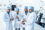 A team of scientists reviewing results in a lab.