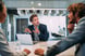 Consultant explanining in a meeting room with a laptop
