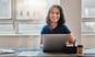 woman 20s smiling laptop GettyImages-1430319207