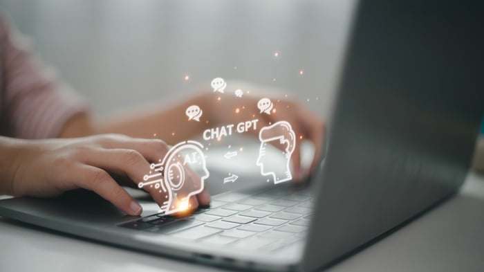 A laptop with a ChatGPT graphic.