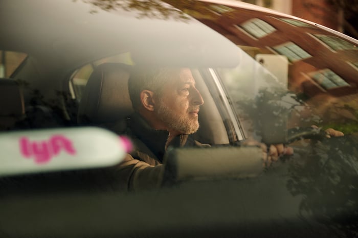 A Lyft driver looking out the window.