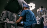 surgeon using intutive surgical davinci robot headset console_intuitive