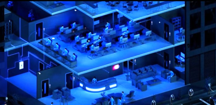 Cross-section of multi-story office building with many people at desks working on computers.