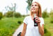 Person drinking bottled drink with a straw