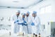 A group of scientists looking at a report.