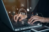 hands typing on keyboard with ETF sign