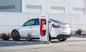 tesla car at super charger station