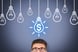 Light bulbs with dollar sign person looking up