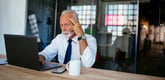 Older man laptop serious