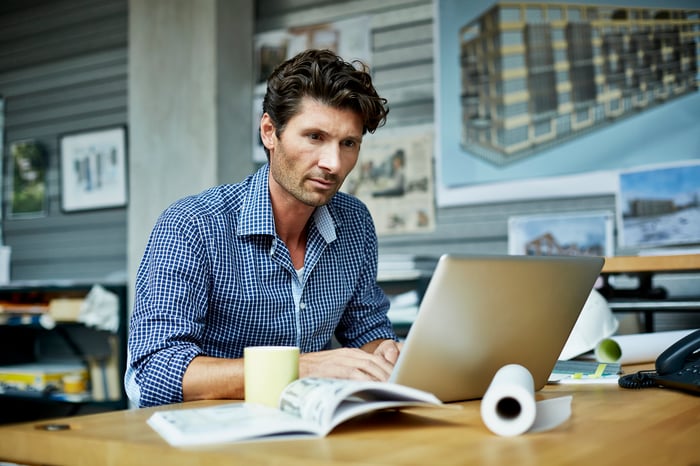 A person working on a laptop.
