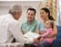 A family reviewing financial results with an advisor.