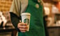 Starbucks_Employee_Holding_Cup_With_Logo_SBUX
