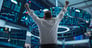 Person raising two fists in the air.