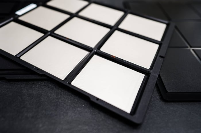 Close up of QuantumScape's solid-state battery technology. Cells are arranged in a black casing. 